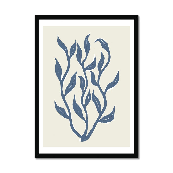 Framed indigo blue lino cut seaweed art print in black frame.