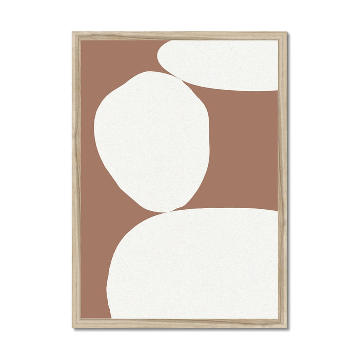 A framed abstract wall art featuring mocha brown and white geometric shapes.
