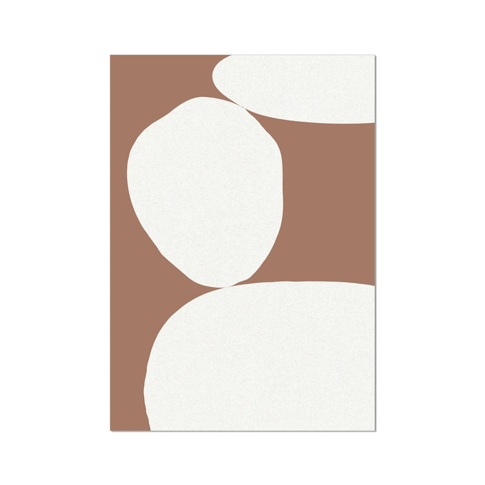 A framed abstract art print featuring mocha brown and white colors with simple geometric shapes.