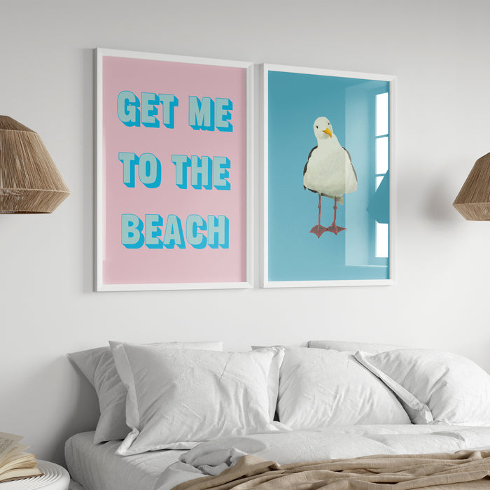 Two framed artworks on a wall above a bed, one with text and the other with a bird illustration.