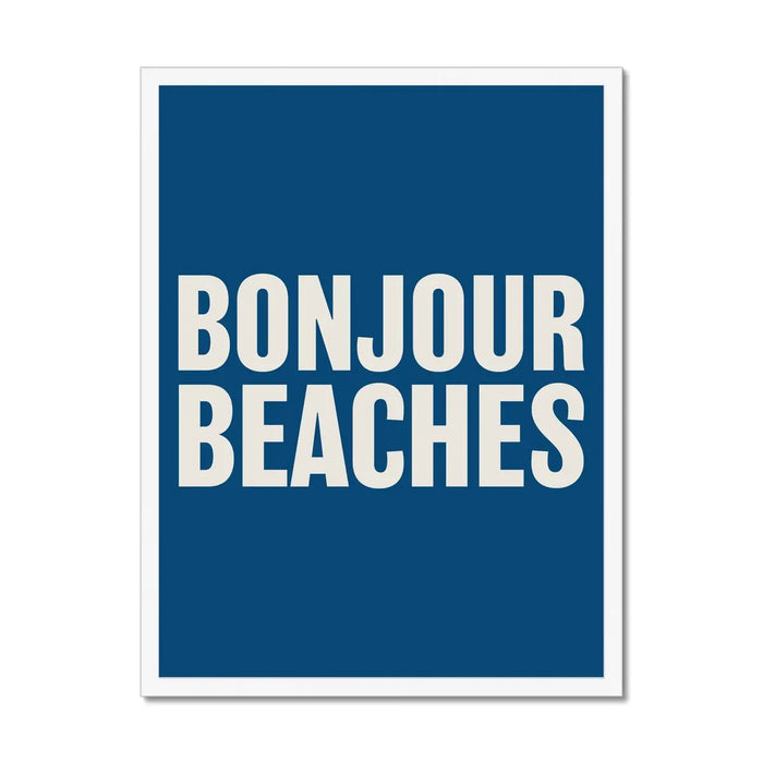 A colourful typography art print with the text 'BONJOUR BEACHES' in bold white letters on a navy blue background, framed on the wall with a white frame.