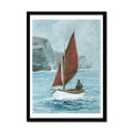 Framed artwork of a sailboat with a red sail on a body of water. Cornish Sea Painting
