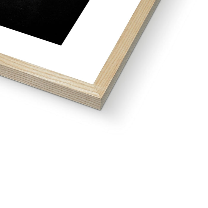 Close-up of a wooden picture frame corner on a white background
