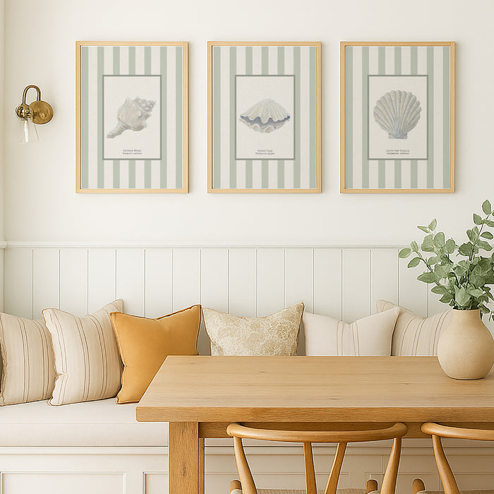 Living room with a wooden table, chairs, and wall art featuring shell prints.