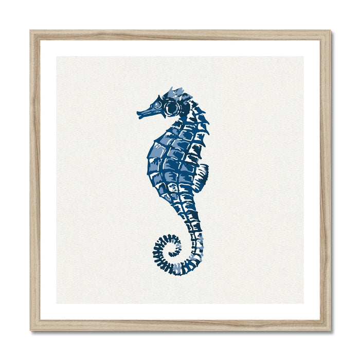 A framed art print of an indigo blue colored seahorse on a white background.