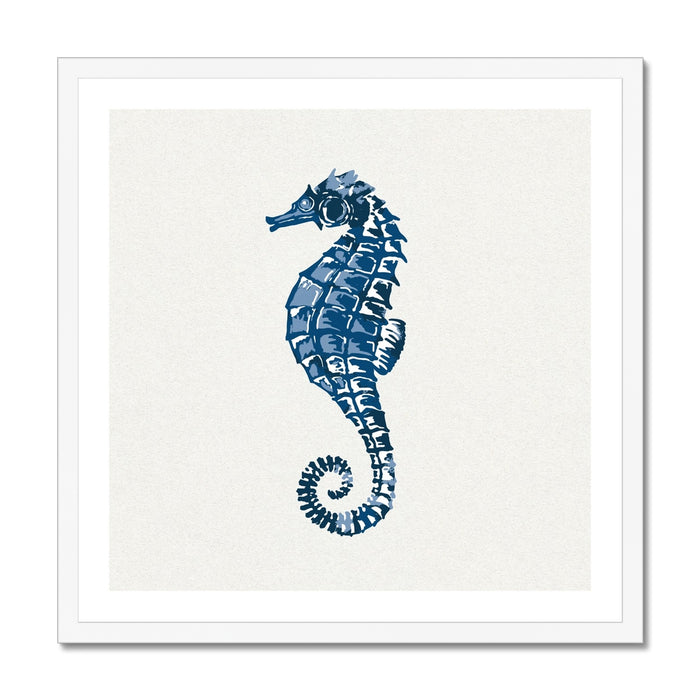 A framed art print of an indigo blue colored seahorse on a white background.