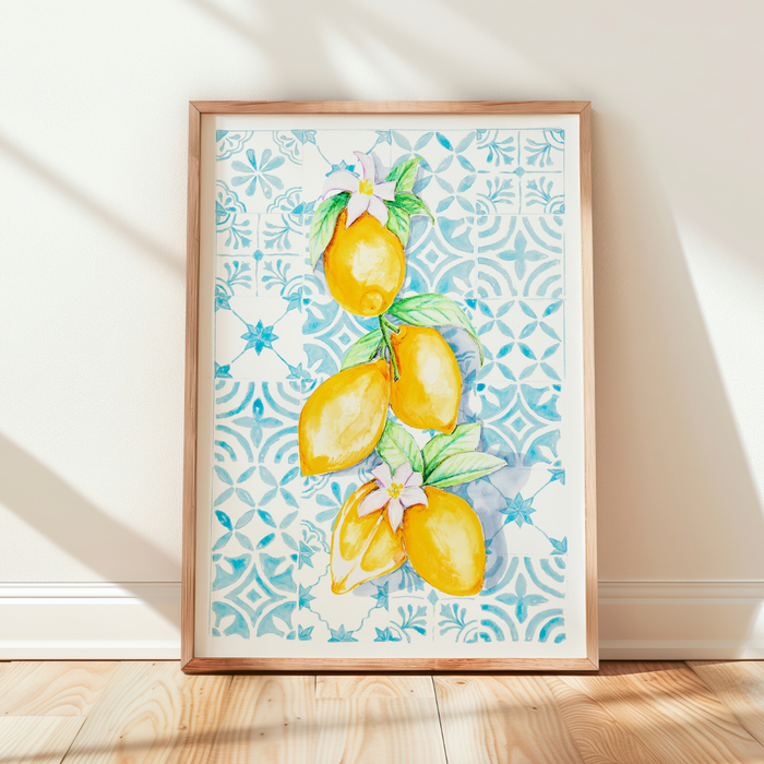 Framed artwork of lemons and flowers on a patterned background