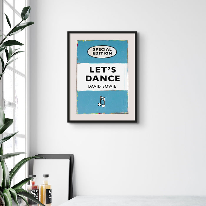 A vintage book cover art print featuring the title 'Let's Dance' by David Bowie with a special edition label, predominantly in aqua blue colour.