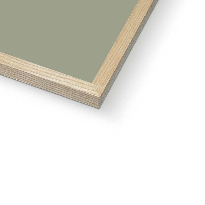 Olive green seaweed painting framed on wall.