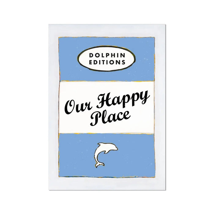 A framed art print featuring a vintage book cover art with the title 'Our Happy Place' and a small Dolphin logo, predominantly in blue tones.
