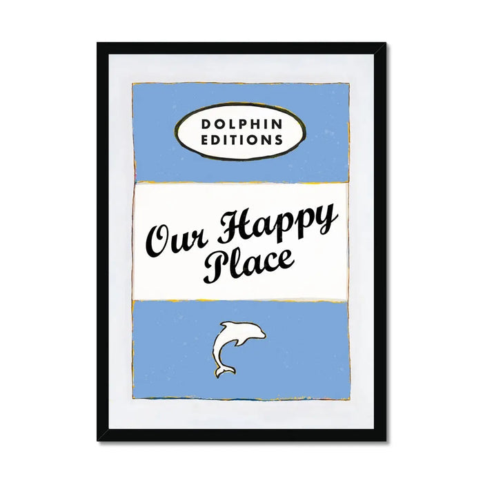 Framed art print of a vintage book cover with the title 'Our Happy Place' and a blue background featuring a white oval and a small dolphin illustration.