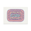 A framed art print of a label depicting a tin of North Atlantic Sardines, with bold red and yellow colours on a white background.