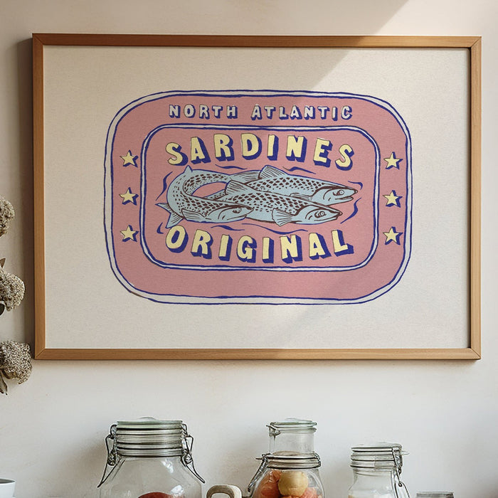 A framed art print of a label depicting a tin of North Atlantic Sardines, with bold red and yellow colours on a white background.