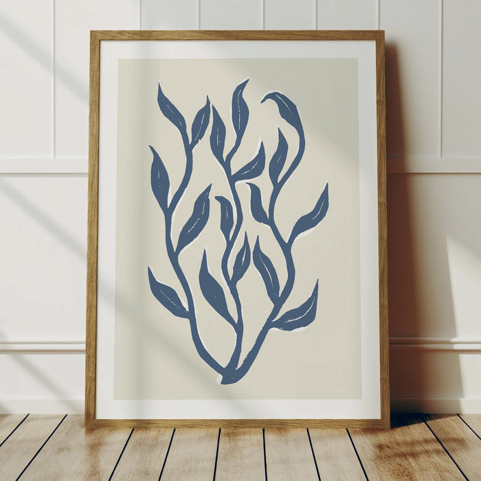 Framed indigo blue lino cut seaweed art print in natural wood frame.