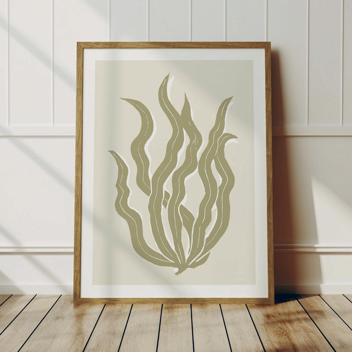 Framed lino cut seaweed print in neutral colours.