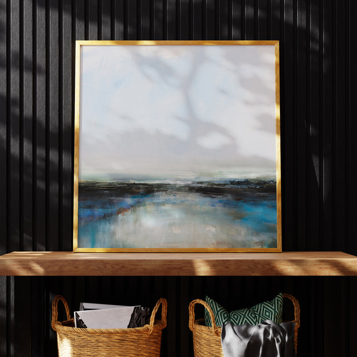 A sea painting print depicting dynamic ocean movements with bold strokes and contrasting hues of blue, black, and white. Framed and on a wooden shelf.