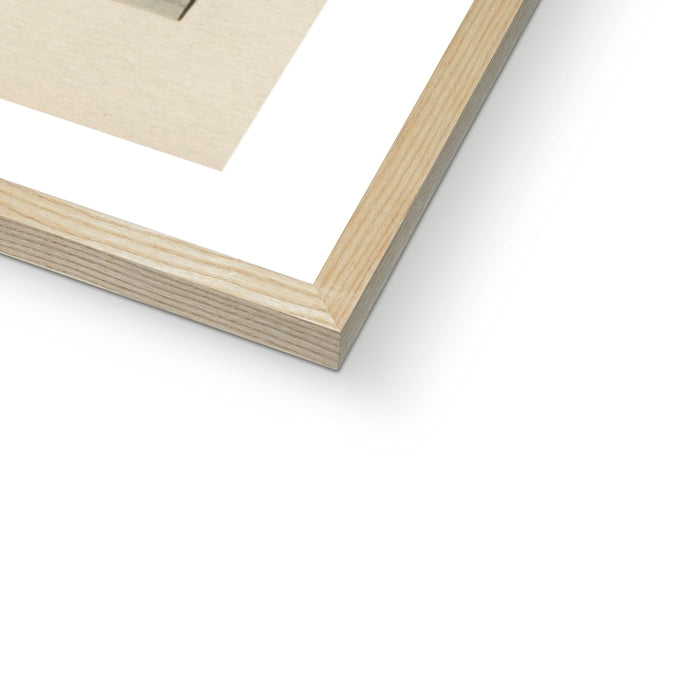 Close-up of a wooden picture frame corner on a white background